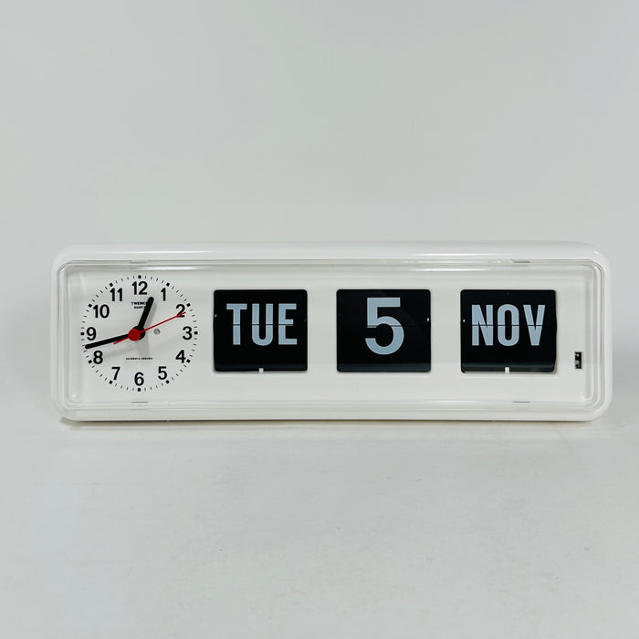 Retro white analog clock with clock face and vintage mechanical flip date, mid-century modern desk or wall clock